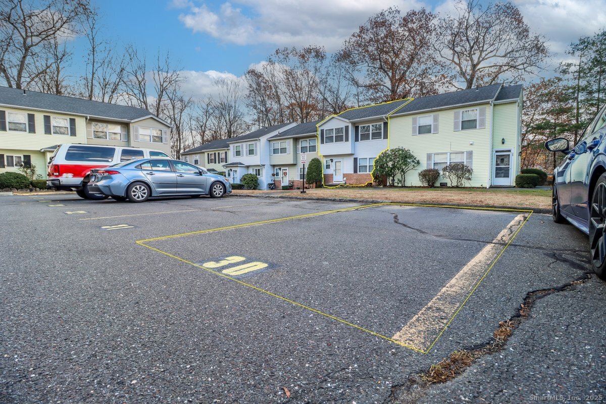 25 Padanaram Road, Unit 30 Danbury, CT 06811 - Photo 21 of 24 a view of a cars park in front of a building
