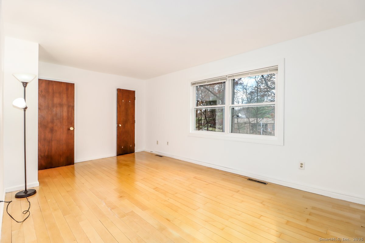 25 Padanaram Road, Unit 30 Danbury, CT 06811 - Photo 10 of 24 an empty room with windows