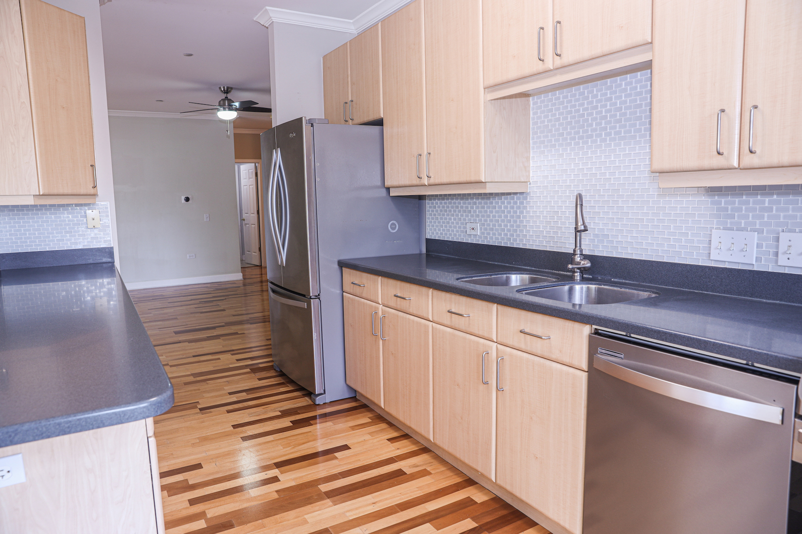 660 McHenry Road, Unit 204 Wheeling, IL 60090 - Photo 12 of 34 a kitchen with stainless steel appliances granite countertop a sink and cabinets