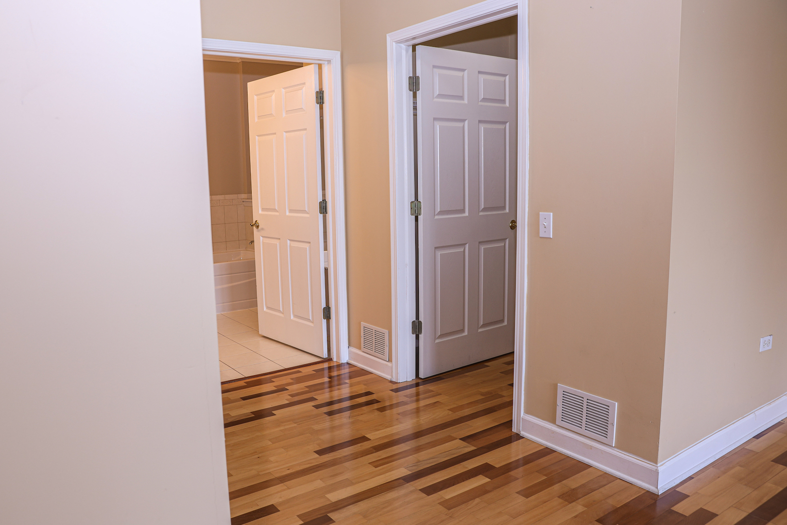660 McHenry Road, Unit 204 Wheeling, IL 60090 - Photo 21 of 34 a view of a hallway with wooden floor