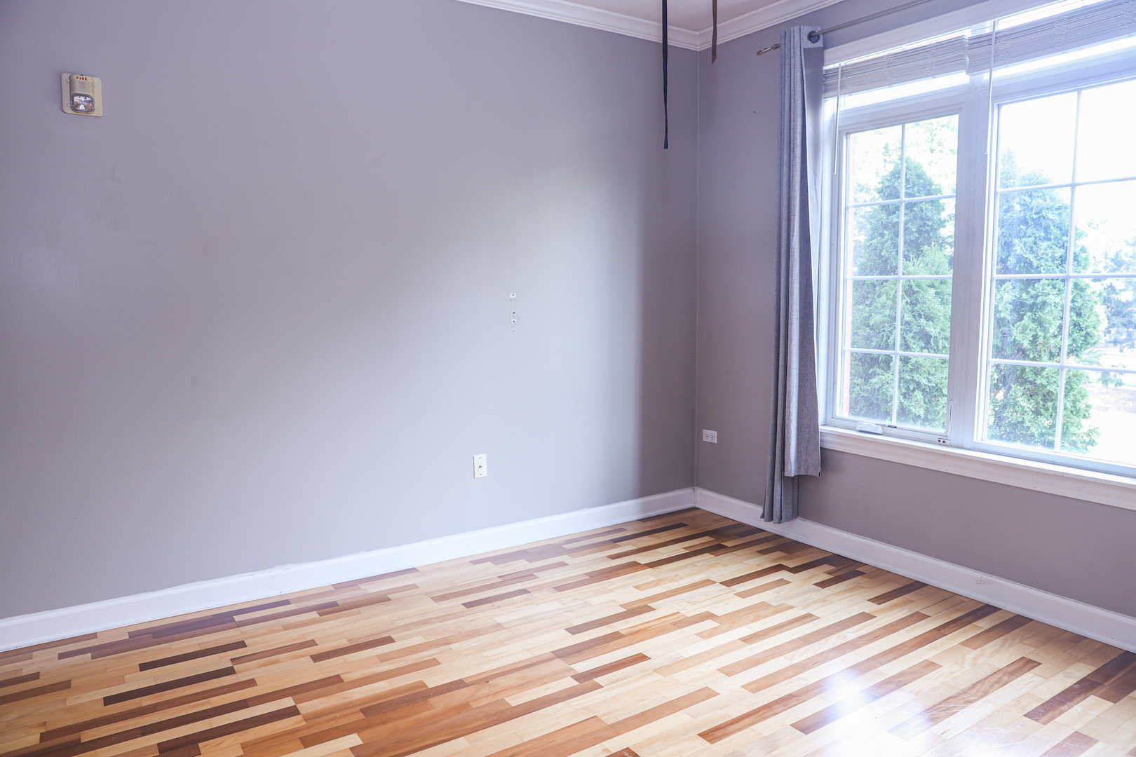660 McHenry Road, Unit 204 Wheeling, IL 60090 - Photo 26 of 34 a view of empty room with wooden floor and fan