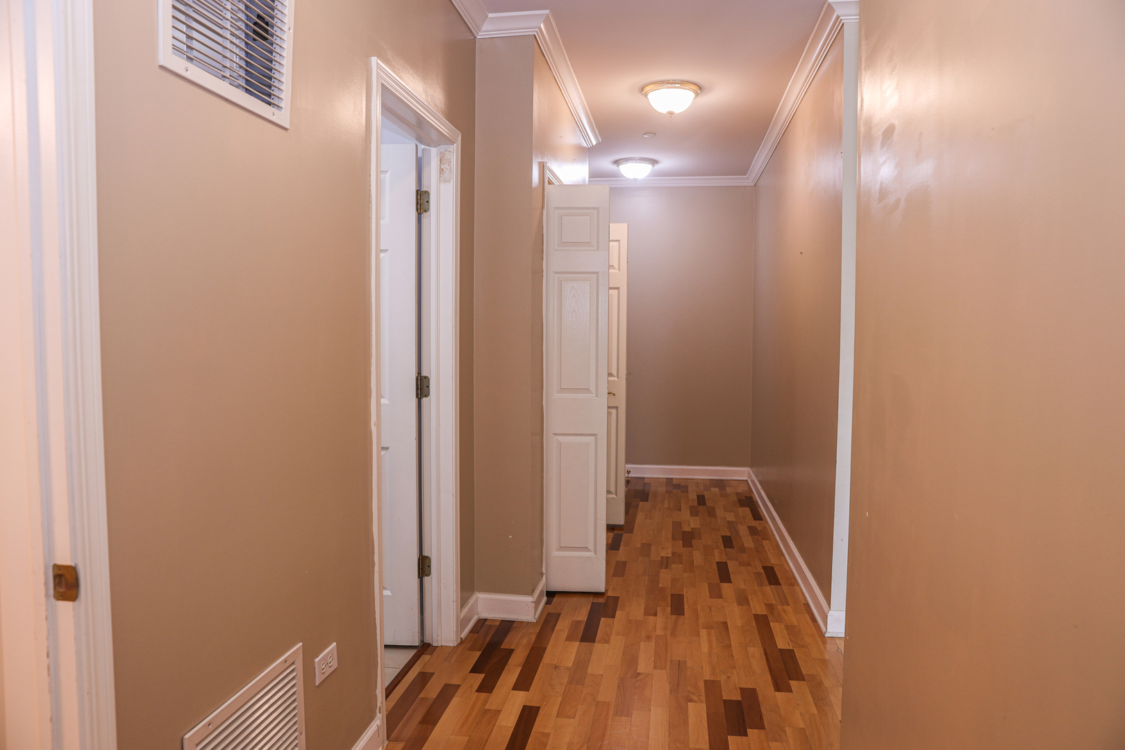 660 McHenry Road, Unit 204 Wheeling, IL 60090 - Photo 32 of 34 a view of a hallway with wooden floor