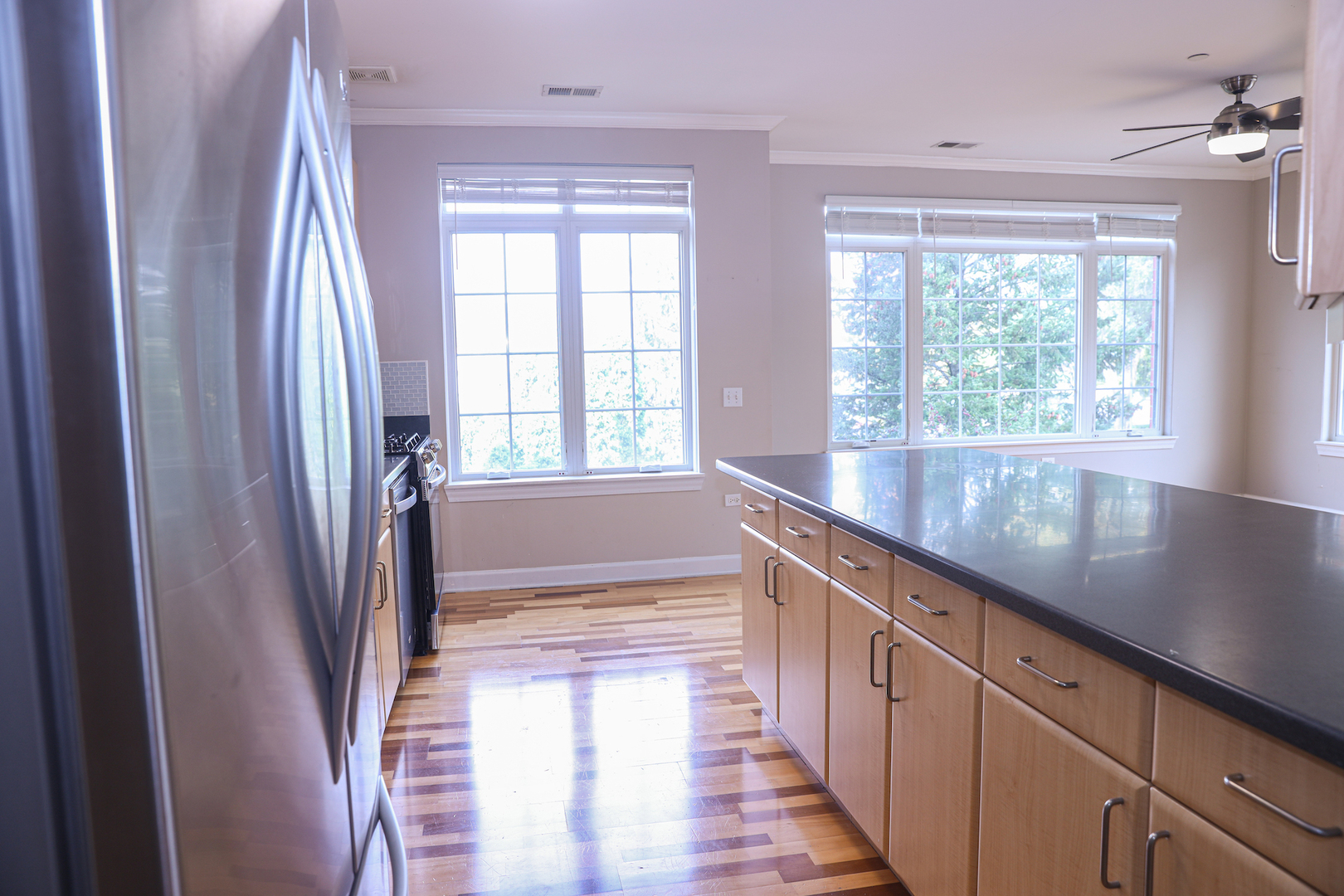 660 McHenry Road, Unit 204 Wheeling, IL 60090 - Photo 10 of 34 a view of a kitchen with a large window
