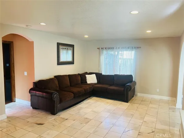 a living room with furniture and window