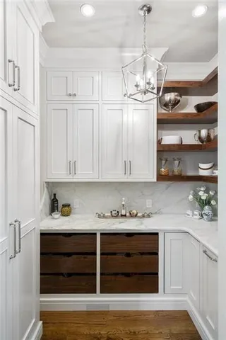 a view of a room with wooden floor