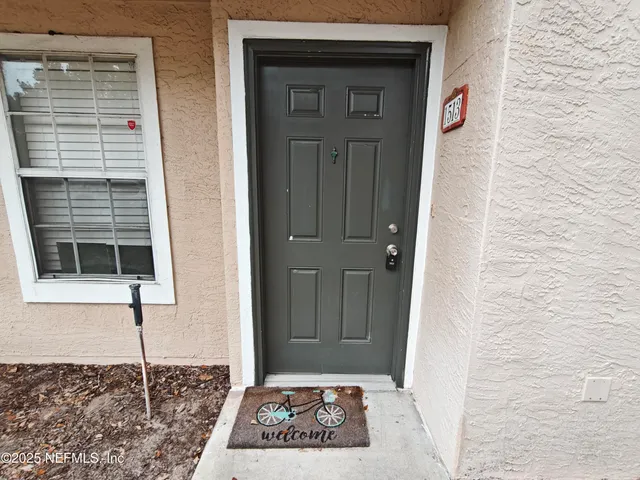 a view of a door and a window