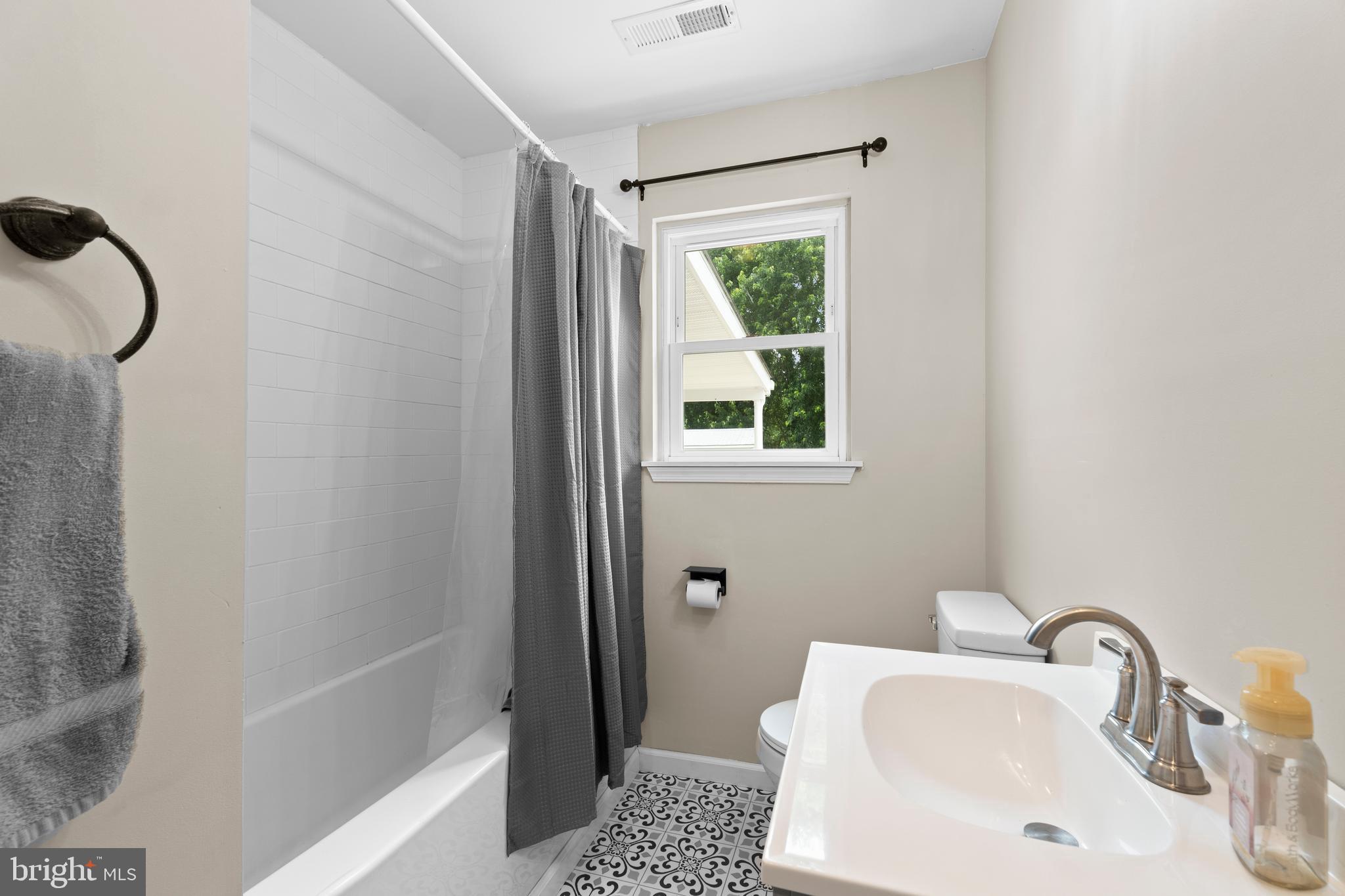 6475 Big Stone Beach Road Milford, DE 19963 - Photo 22 of 52 a bathroom with a sink a toilet and shower