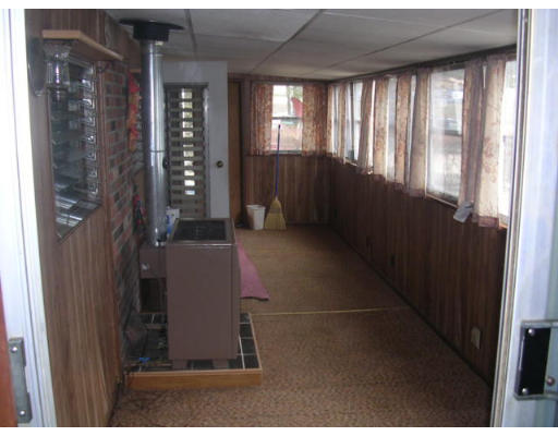 376 Worcester Road, Unit 6 Charlton, MA 01507 - Photo 3 of 6 a view of an empty room with a window