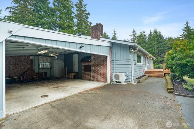 a house with green field in front of it