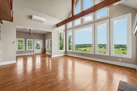 a kitchen with refrigerator and cabinets
