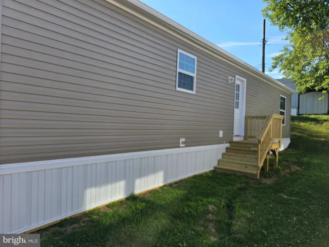 a view of a bench in the backyard