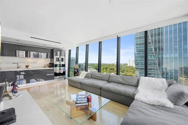 a living room with furniture and a large window