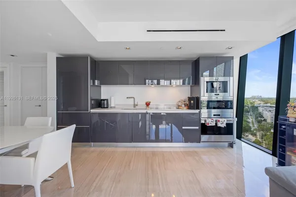 a view of kitchen with furniture and large window