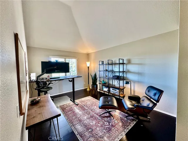 a view of a workspace with furniture