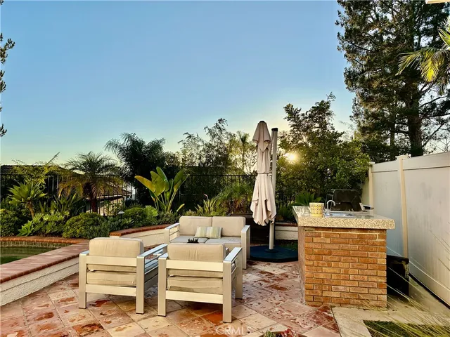 a view of a patio with couches and potted plants