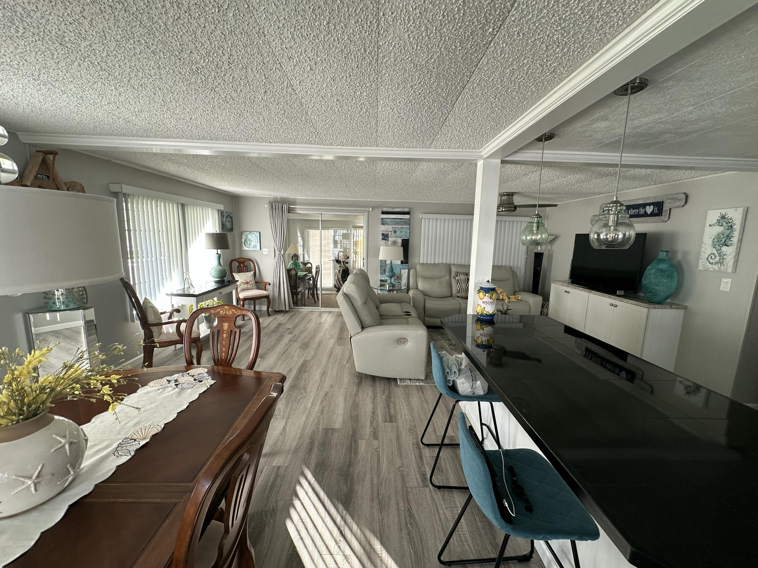 8281 South Street Boca Raton, FL 33433 - Photo 11 of 33 a living room with furniture and a wooden floor