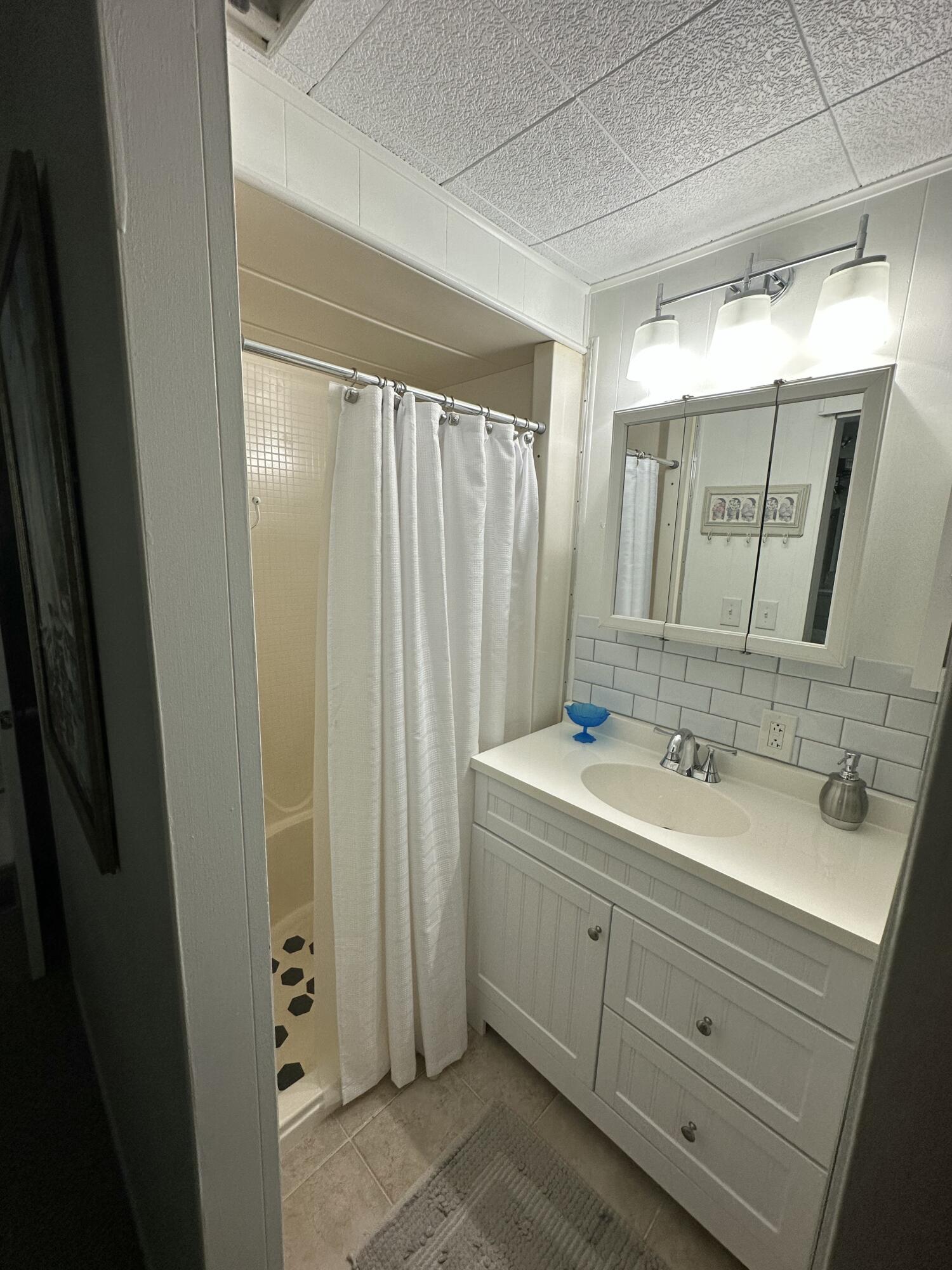 8281 South Street Boca Raton, FL 33433 - Photo 18 of 33 a bathroom with a double vanity sink and mirror