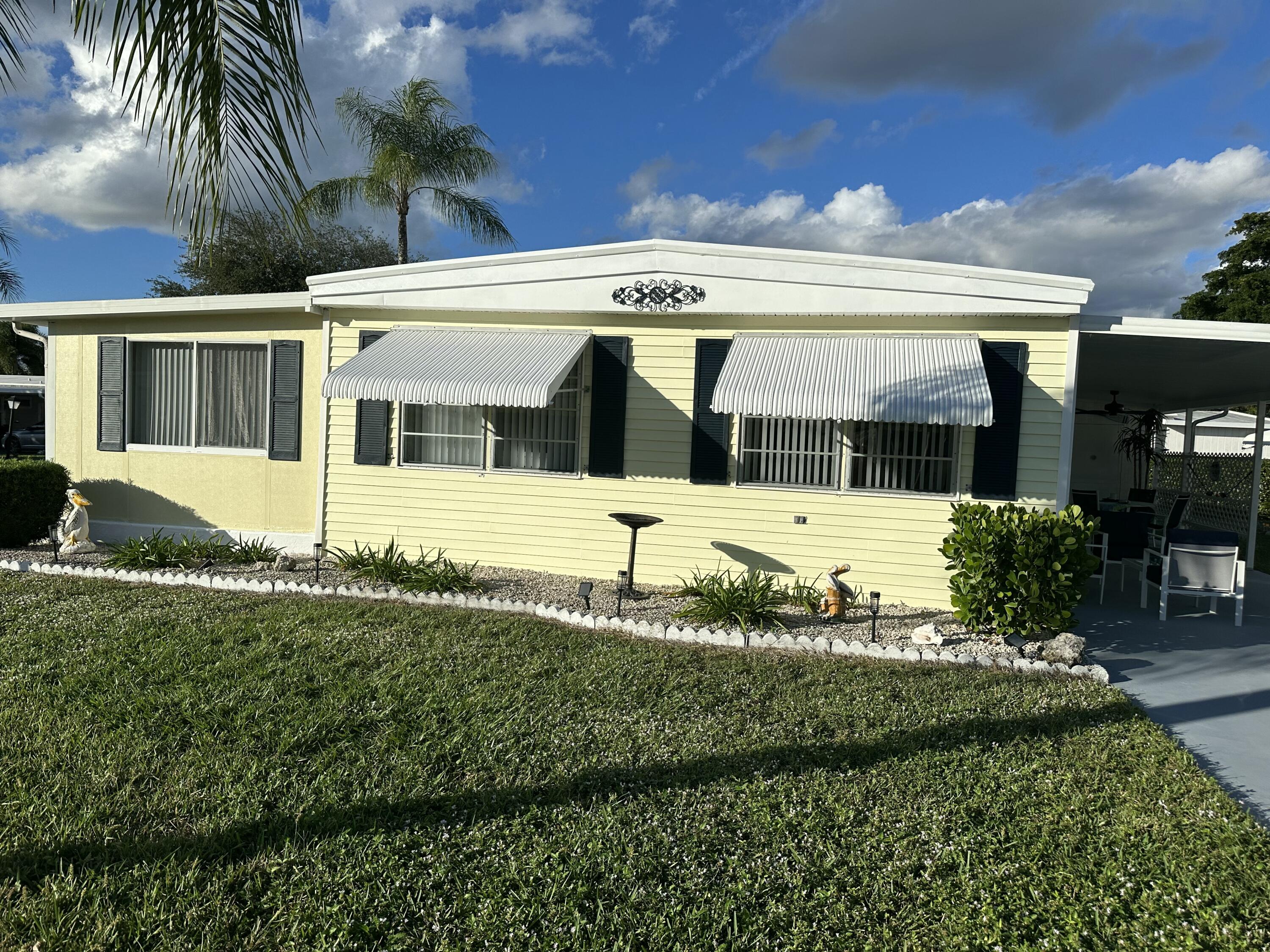 8281 South Street Boca Raton, FL 33433 - Photo 2 of 33 a view of a house with a swimming pool