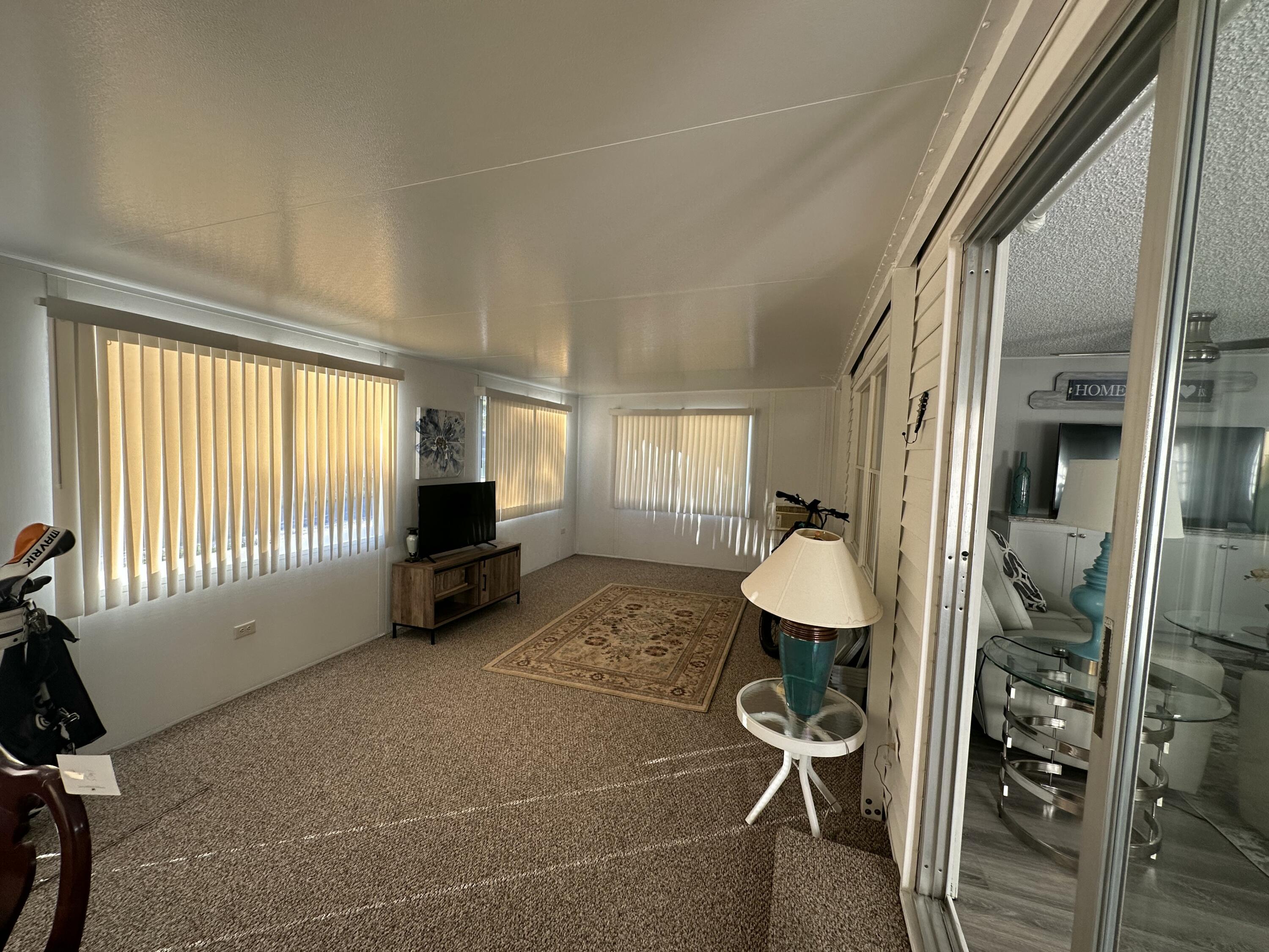 8281 South Street Boca Raton, FL 33433 - Photo 27 of 33 a view of a livingroom with furniture and a window