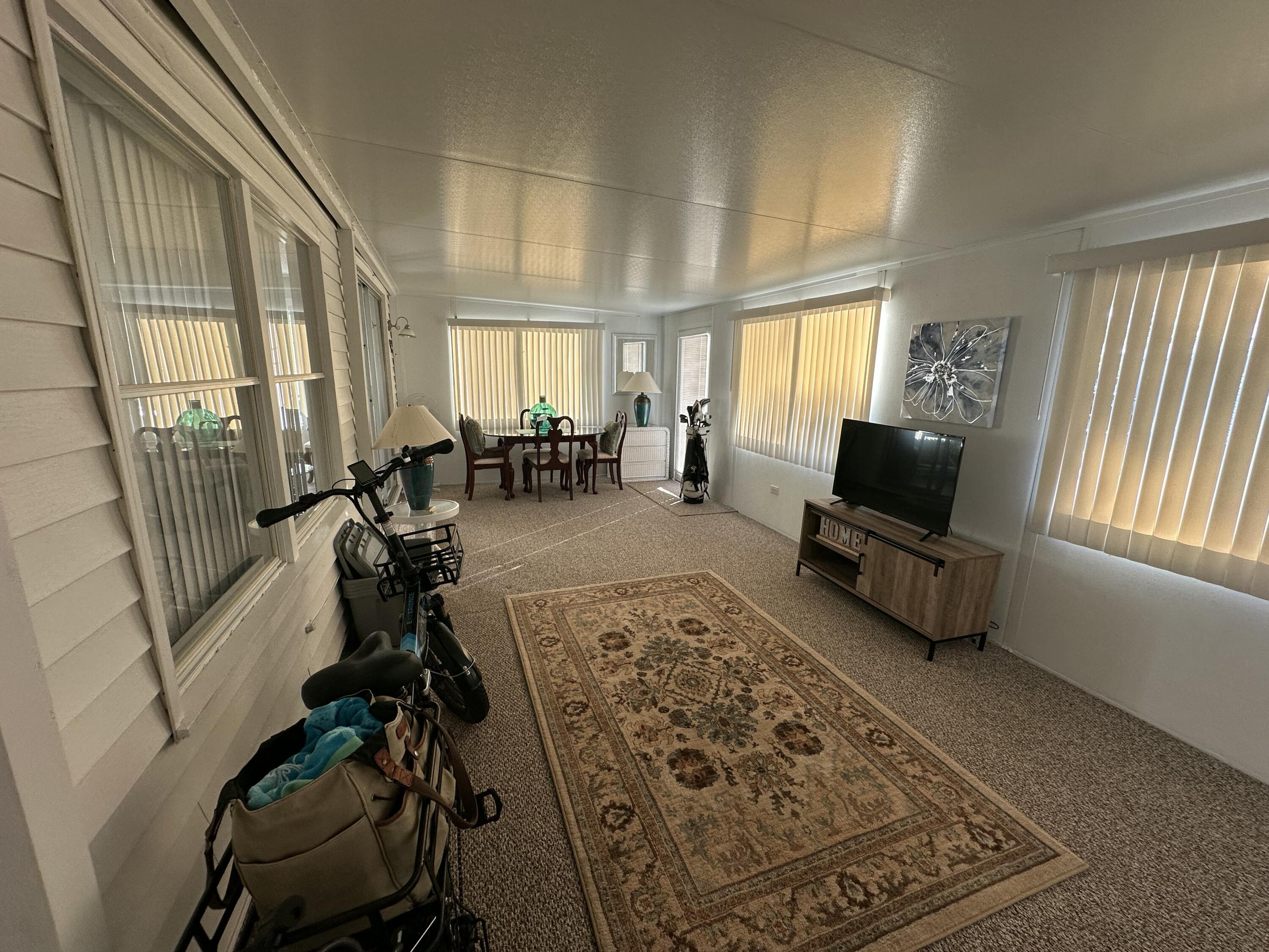 8281 South Street Boca Raton, FL 33433 - Photo 28 of 33 a view of a livingroom with furniture and a flat screen tv