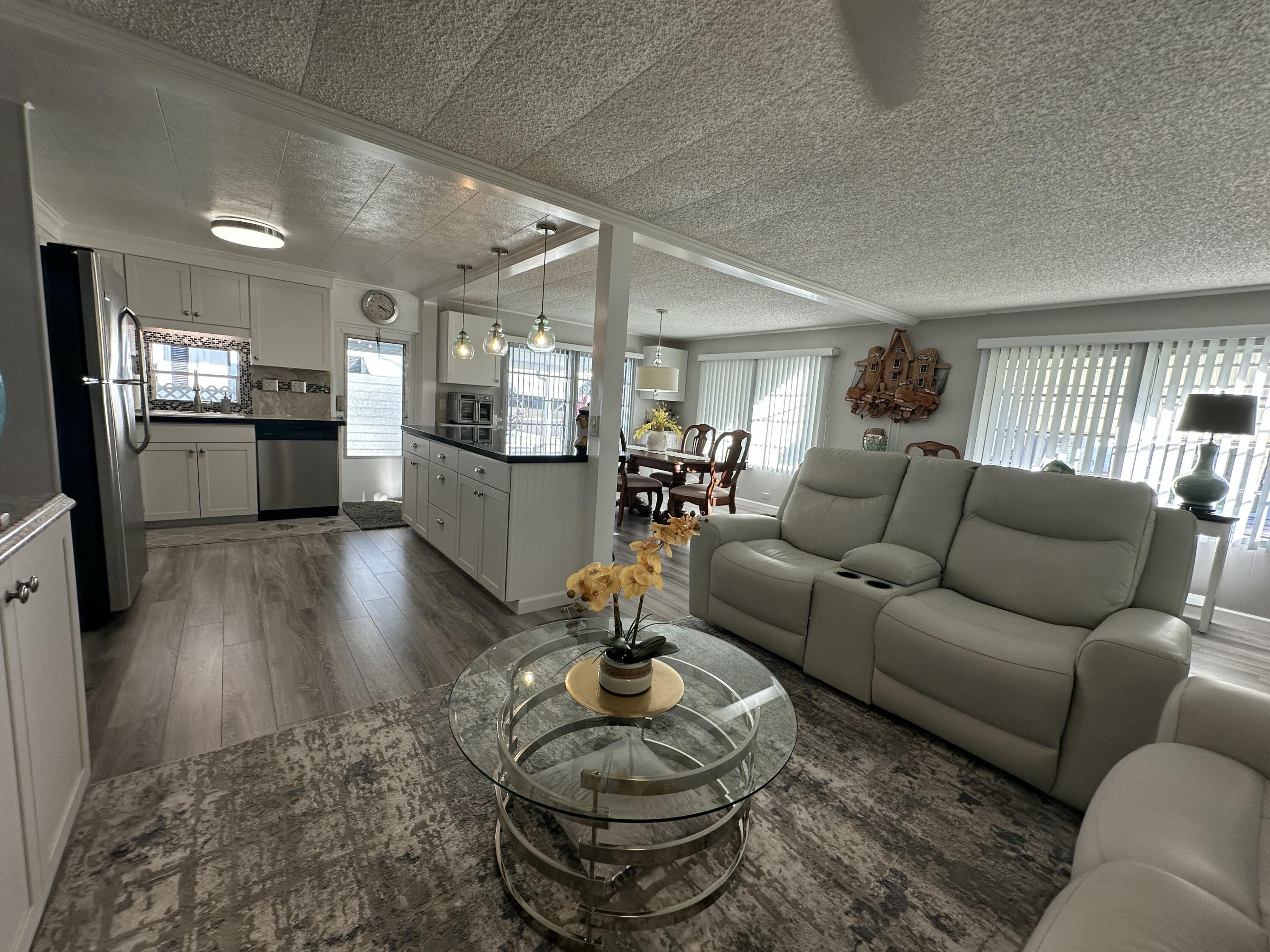 8281 South Street Boca Raton, FL 33433 - Photo 7 of 33 a living room with furniture and a wooden floor