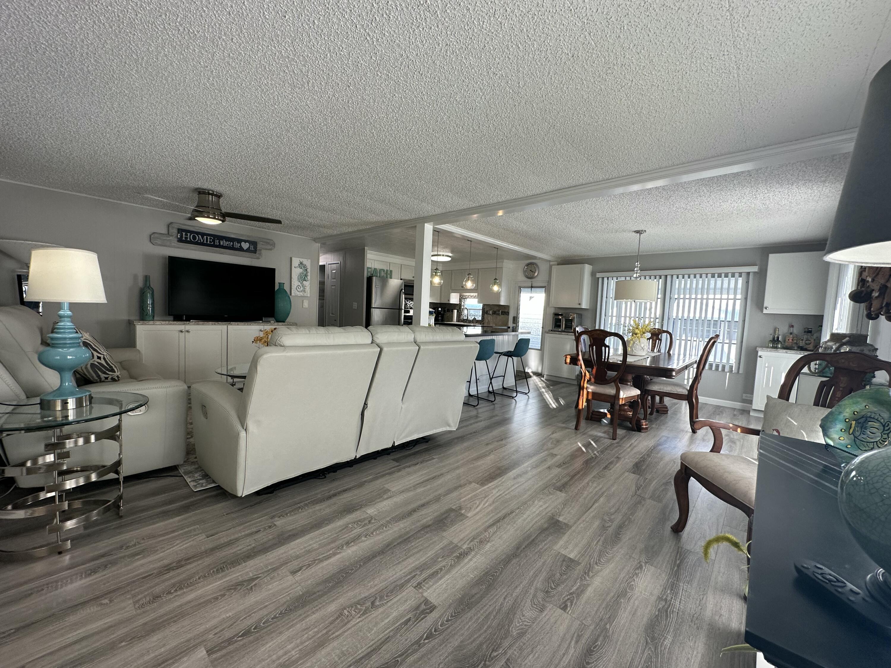 8281 South Street Boca Raton, FL 33433 - Photo 8 of 33 a living room with furniture and wooden floor