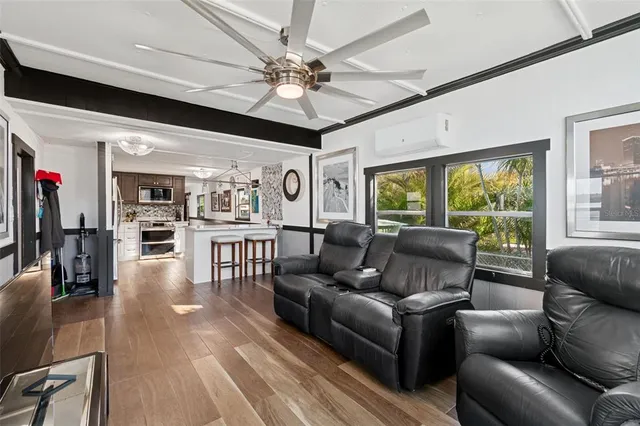 a kitchen with a sink stainless steel appliances a counter space and a window