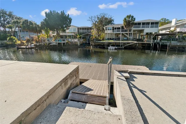 an aerial view of a house with a yard basket ball court and outdoor seating