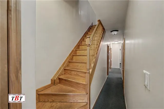a bedroom with a bed and glass window