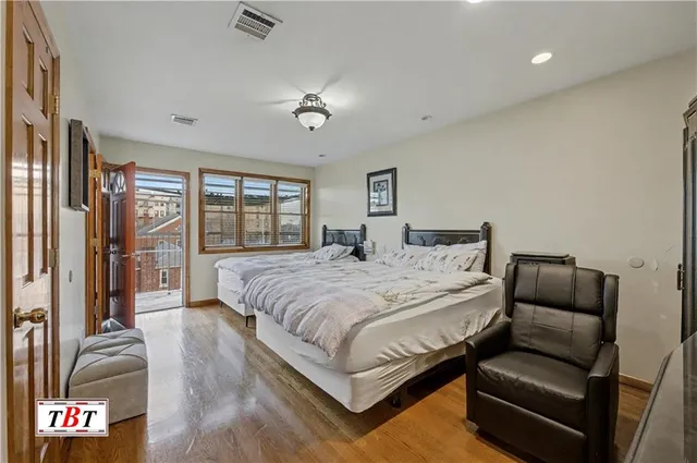 a bathroom with a granite countertop toilet sink and mirror