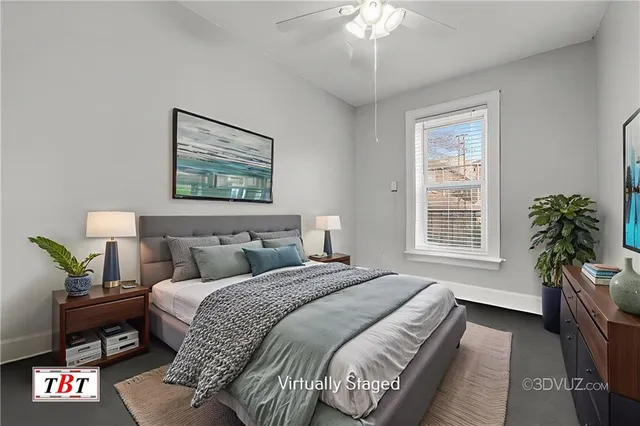 a bedroom with two beds and a chandelier