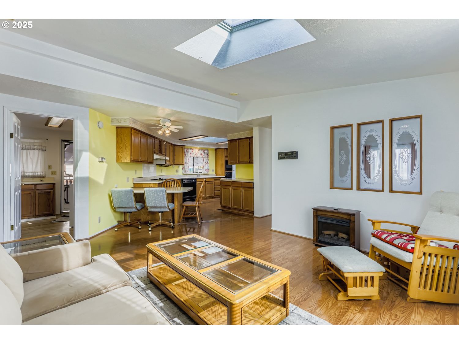 1504 Frontier Circle Forest Grove, OR 97116 - Photo 13 of 27 a living room with furniture a rug and a flat screen tv