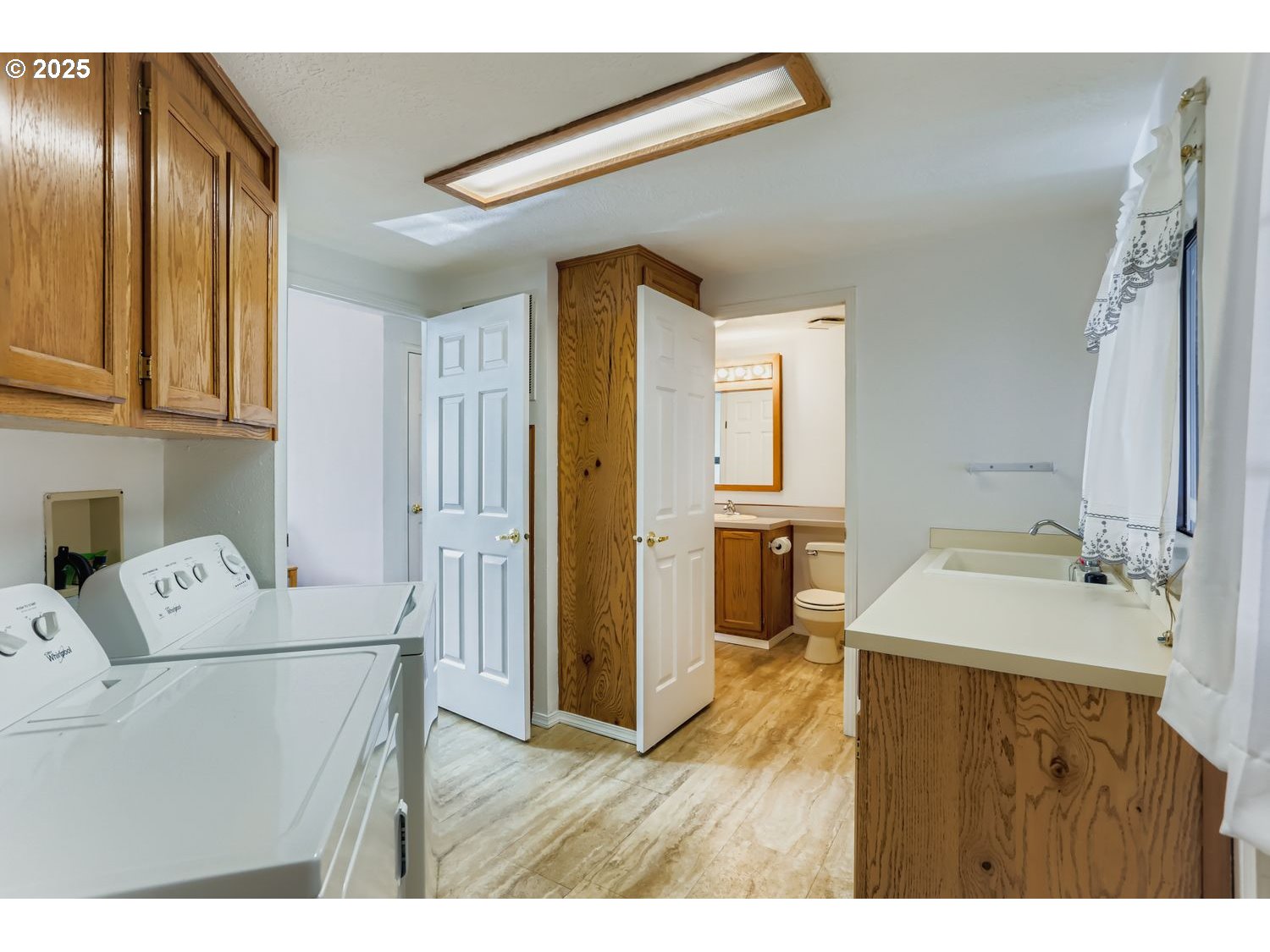 1504 Frontier Circle Forest Grove, OR 97116 - Photo 23 of 27 a bathroom with a sink a mirror and a toilet