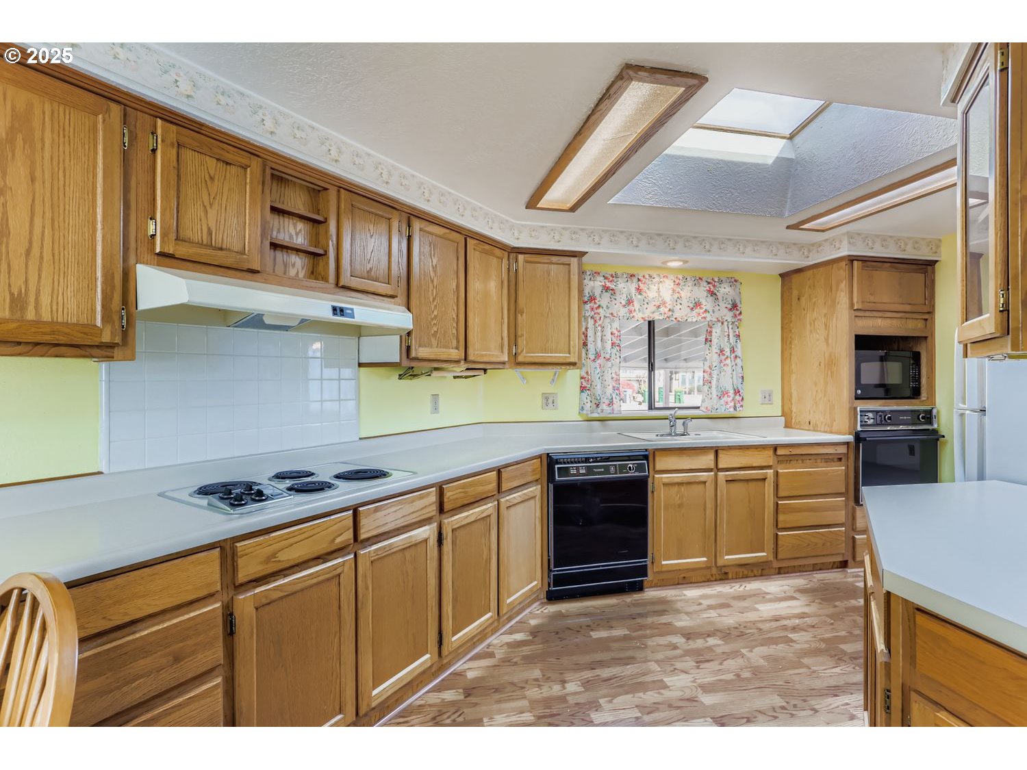 1504 Frontier Circle Forest Grove, OR 97116 - Photo 10 of 27 a kitchen with stainless steel appliances granite countertop a stove sink and cabinets
