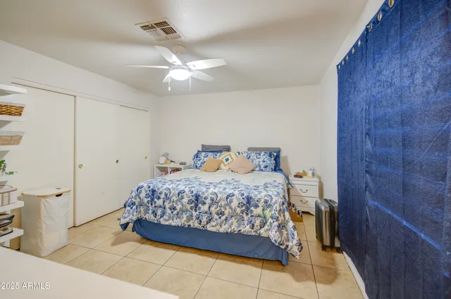 a bedroom with a bed and a walk in closet