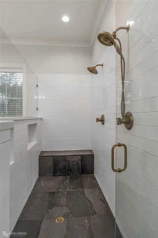 a bathroom with a toilet sink vanity tub and shower