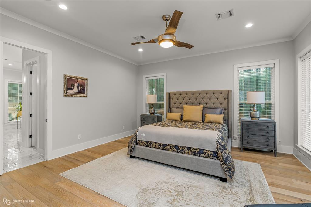 145 Crouch Road Benton, LA 71006 - Photo 19 of 40 a bedroom with a bed and a large window