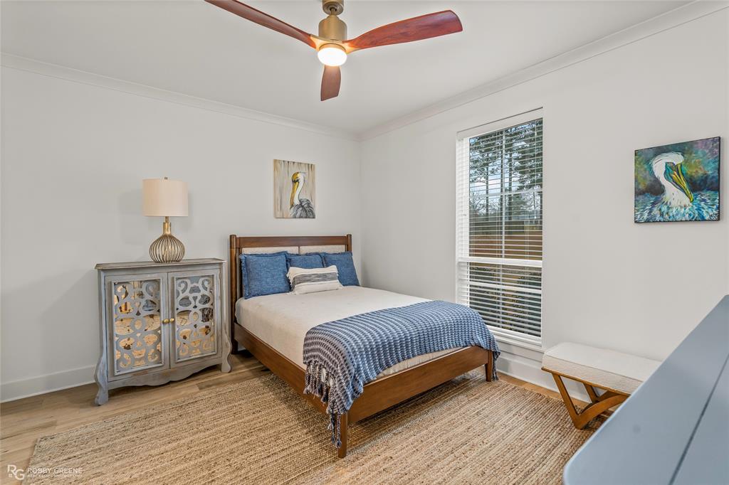 145 Crouch Road Benton, LA 71006 - Photo 26 of 40 a bedroom with a bed and a window