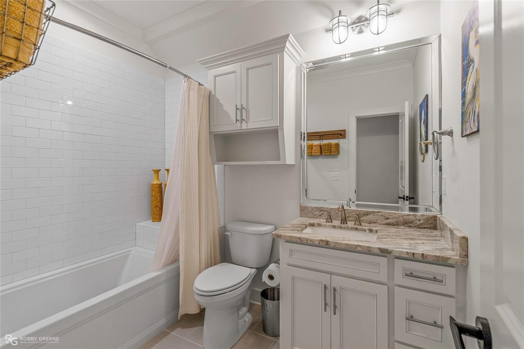 145 Crouch Road Benton, LA 71006 - Photo 35 of 40 a bathroom with a granite countertop sink toilet and shower