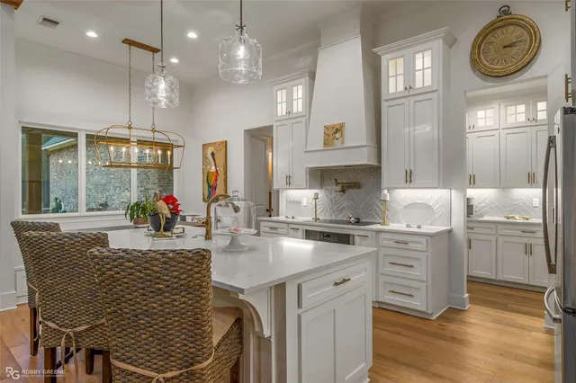 a kitchen with cabinets and stainless steel appliances