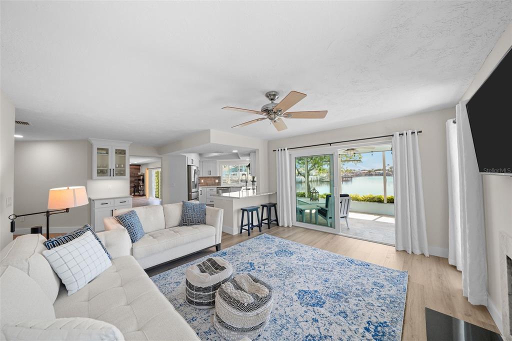 4968 South Shore Drive New Port Richey, FL 34652 - Photo 12 of 60 a living room with furniture and a large window