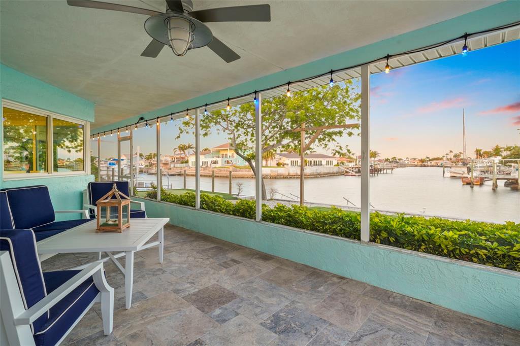 4968 South Shore Drive New Port Richey, FL 34652 - Photo 14 of 60 a living room with furniture and a floor to ceiling window
