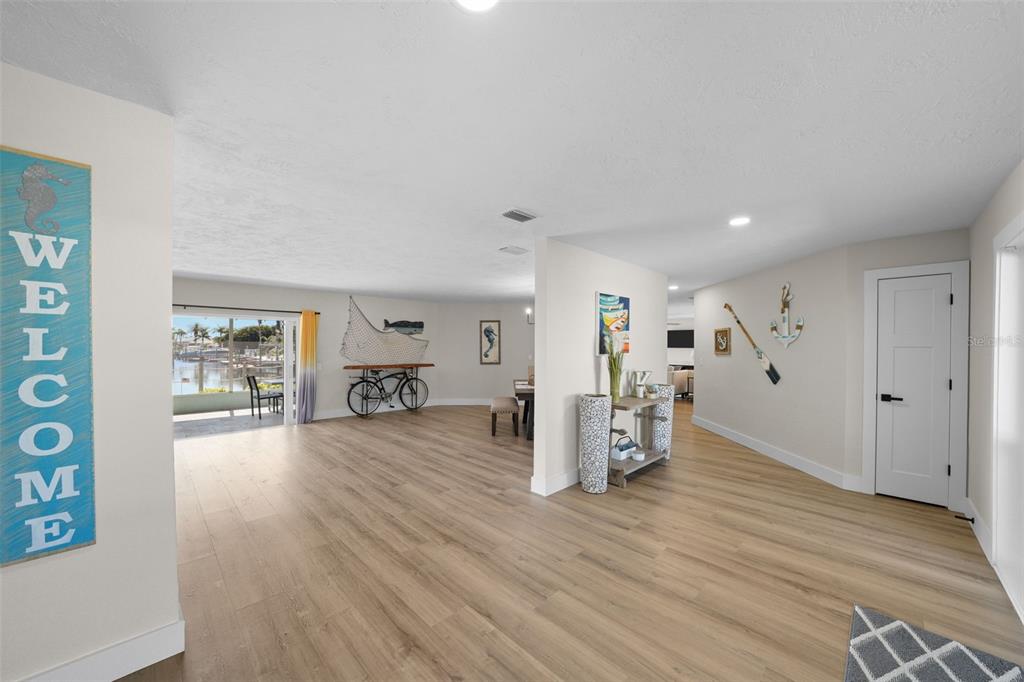 4968 South Shore Drive New Port Richey, FL 34652 - Photo 16 of 60 a view of a livingroom with furniture and wooden floor