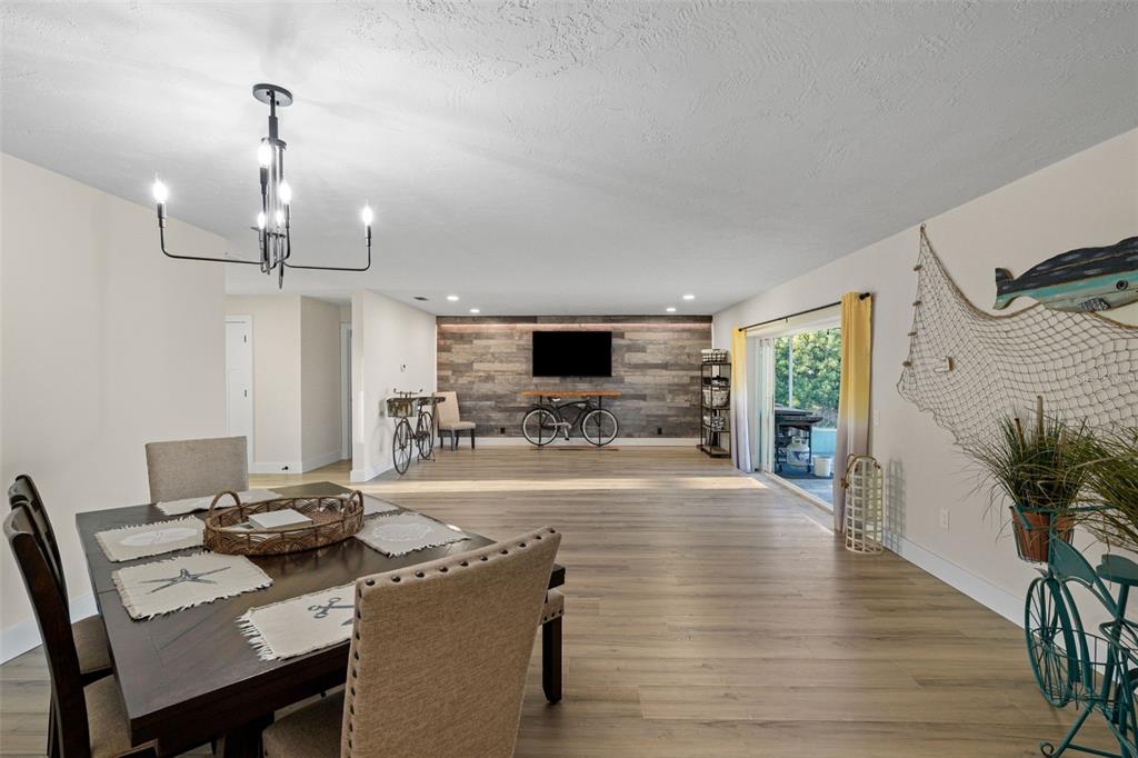 4968 South Shore Drive New Port Richey, FL 34652 - Photo 21 of 60 a living room with furniture and a flat screen tv