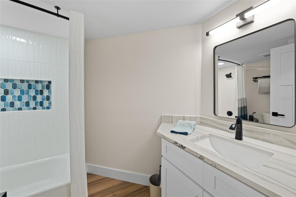 4968 South Shore Drive New Port Richey, FL 34652 - Photo 27 of 60 a bathroom with a sink and a mirror