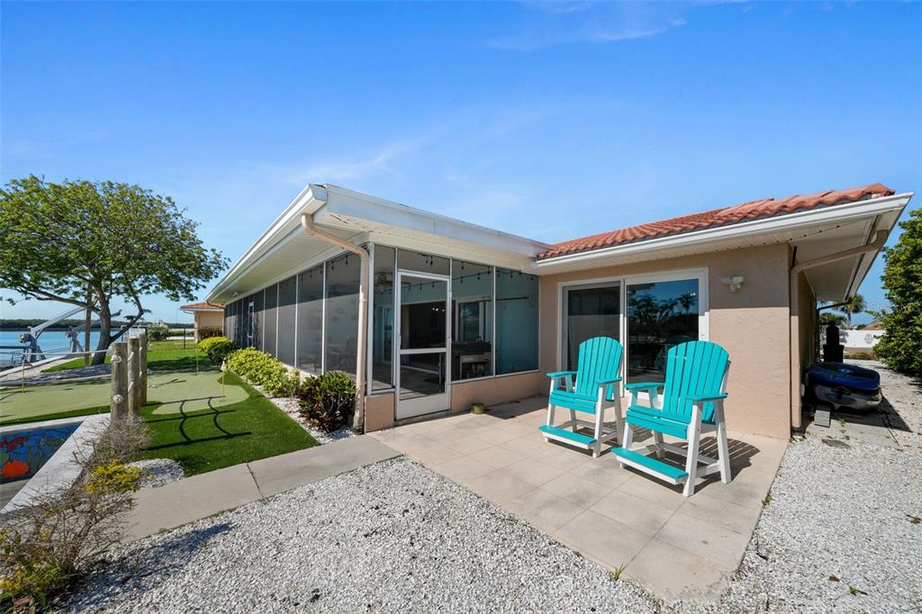 4968 South Shore Drive New Port Richey, FL 34652 - Photo 39 of 60 a front view of a house with sitting area