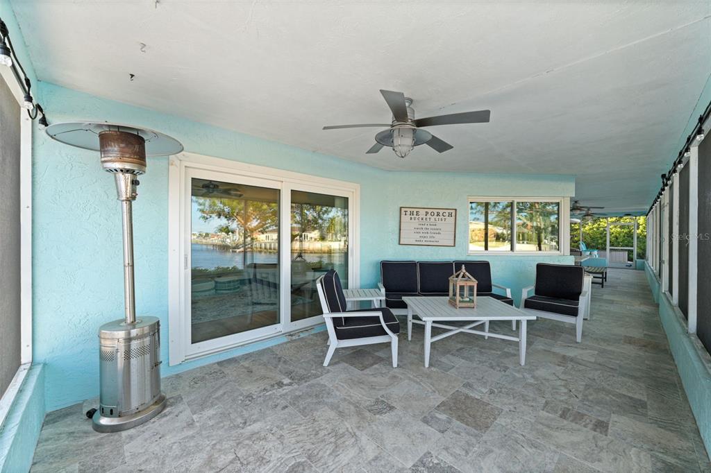 4968 South Shore Drive New Port Richey, FL 34652 - Photo 45 of 60 a dining room with furniture and a floor to ceiling window