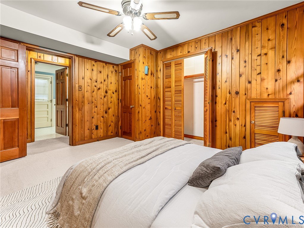 12911 Percival Street Chester, VA 23831 - Photo 11 of 21 a bedroom with a bed and a chandelier