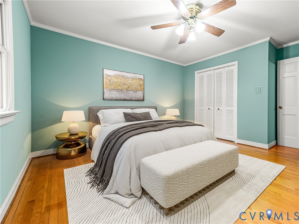 12911 Percival Street Chester, VA 23831 - Photo 13 of 21 a bedroom with a bed and wooden floor