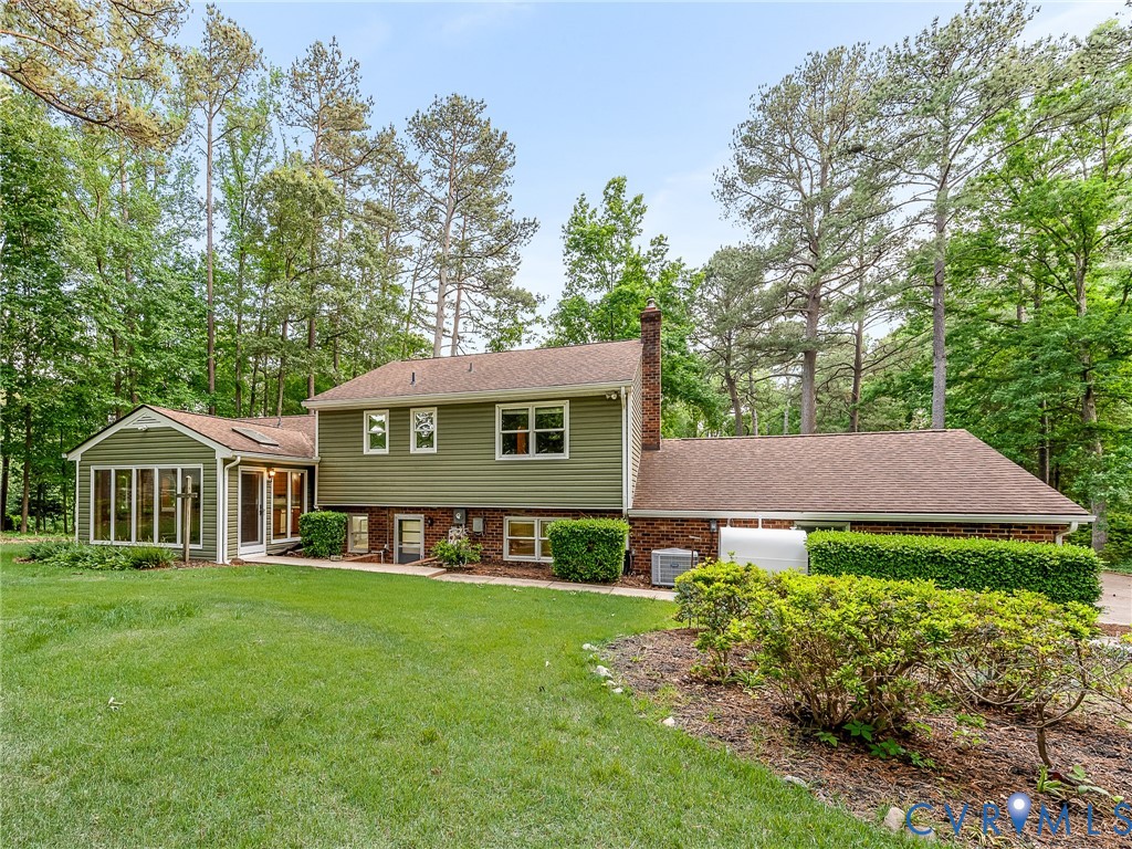 12911 Percival Street Chester, VA 23831 - Photo 20 of 21 a view of a house with a big yard plants and large trees
